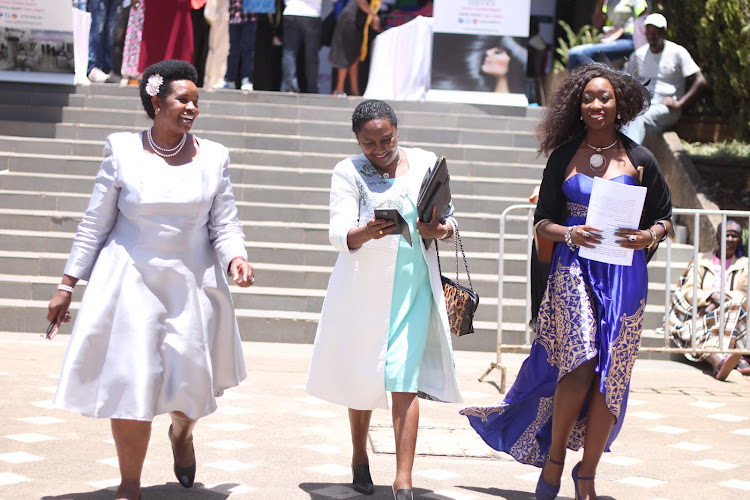 Youth ministry representatives Mary Kimonye and Florence Muinde with Ashleys director Ashley Mungai