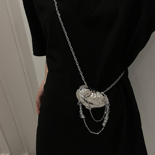 Title 7, Shell Bag with Silver Metal Accessories. A styl...