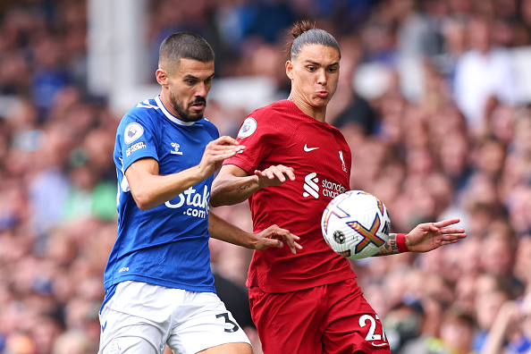 Conor Coady of Everton tackles Darwin Nunez of Liverpool during their Premier League match at Goodison Park on September 3, 2022 in Liverpool, United Kingdom.