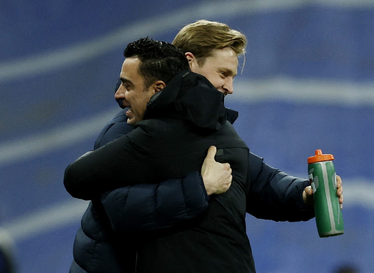 Barcelona coach Xavi Hernández celebrates with Frenkie de Jong after the match against Real Madrid in Madrid, Spain, March 20 2022. Picture: SUSANA VERA/REUTERS