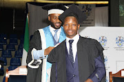 Top Achiever Sizwe Maguni, being hooded by Zakhele Gumede, Deputy Register: Student Administration. Picture: SUPPLIED