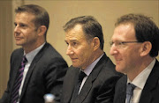 PRUDENTLY OPTIMISTIC: Glencore directors Clinton Ephron and Richard Cohen and CEO Ivan Glasenberg, centre, brief journalists at the Melrose Arch Hotel in Johannesburg this week