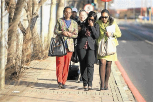 IN TEARS: Zenani Mandela, right, with her niece Zoleka outside the Johannesburg Magistrate's Court yesterday. PHOTO: MABUTI KALI