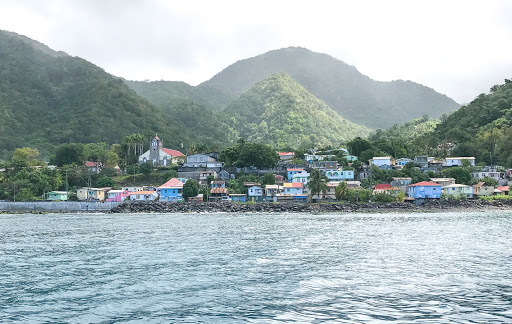 Colorful houses line the western coastline of Dominica. 