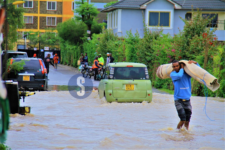 Vehicles along the flooded Syokimau-Katani road in Machakos County on Sunday, April 21, 2024.