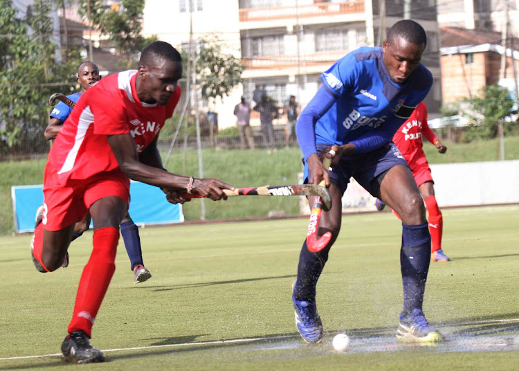 Kenneth Nyongesa of Butali Sugar vies for the ball with Calvins Kanu of Police