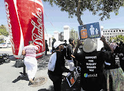 Protesters gather outside parliament in Cape Town where the first round of oral submissions was held yesterday as part of the hearings into a proposed 'sugar' tax on soft drinks, energy drinks and sweetened milk.