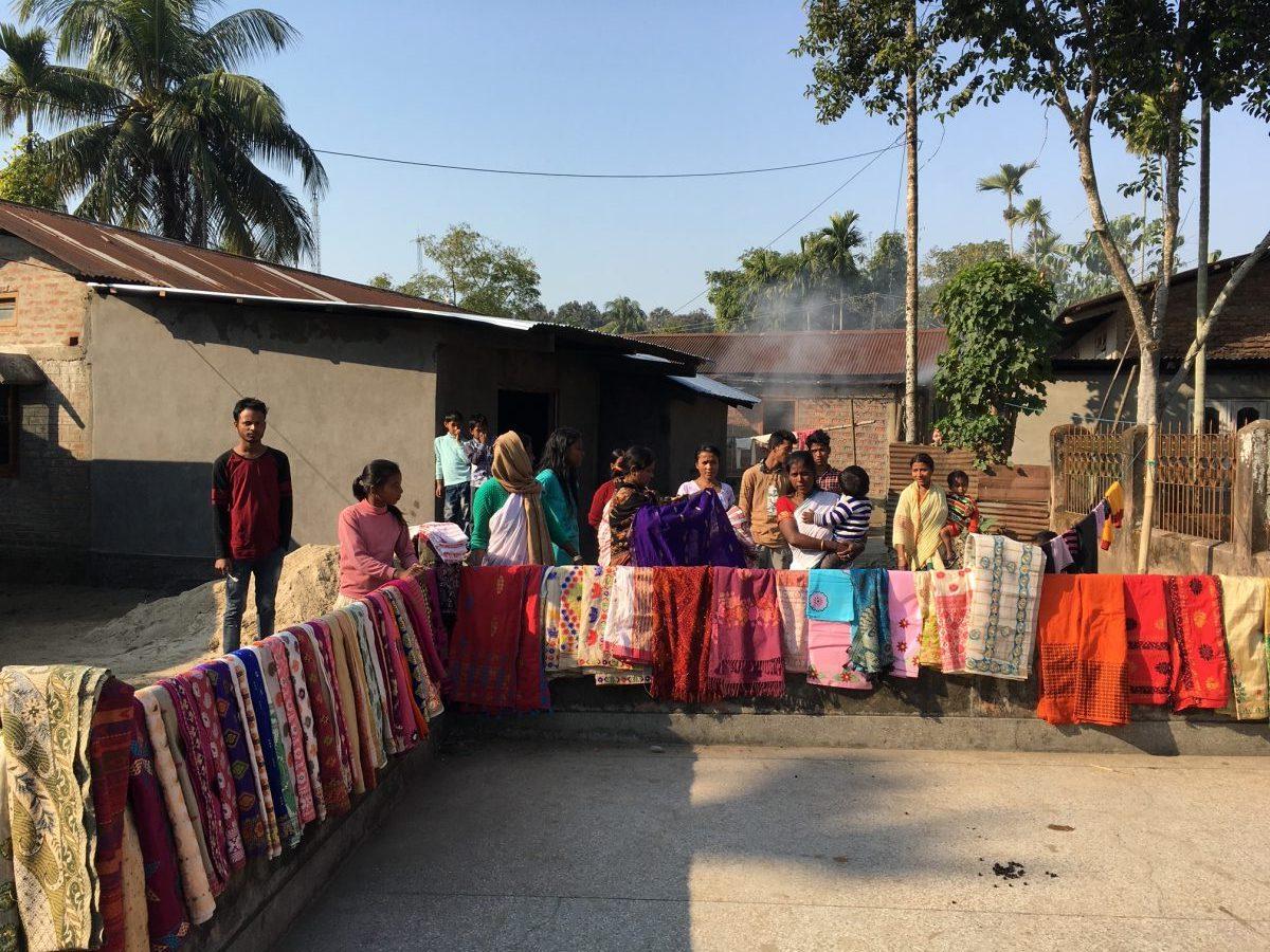 saress and textiles for sale in a village