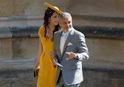 George Clooney and his wife British lawyer Amal Clooney arrive for the wedding ceremony of Britain's Prince Harry, Duke of Sussex and Meghan Markle at St George's Chapel, Windsor Castle, in Windsor, on May 19, 2018. 