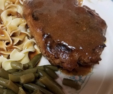 Salisbury Steak with brown gravy and noodles