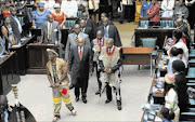 CHIEFS' INDABA:
       President Jacob Zuma, 
      
       with 
      
       chairman of the National House of Traditional Leaders Kgosi Makeru Maubane and other leaders, arriving in Parliament yesterday. 
       photo: KOPANO TLAPE