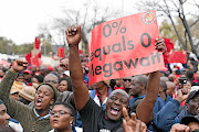 Eskom employees demonstrate  outside the power utility's head office at Megawatt Park in Sunninghill, Johannesburg, last week. The workers  are demanding a 15% salary hike. 