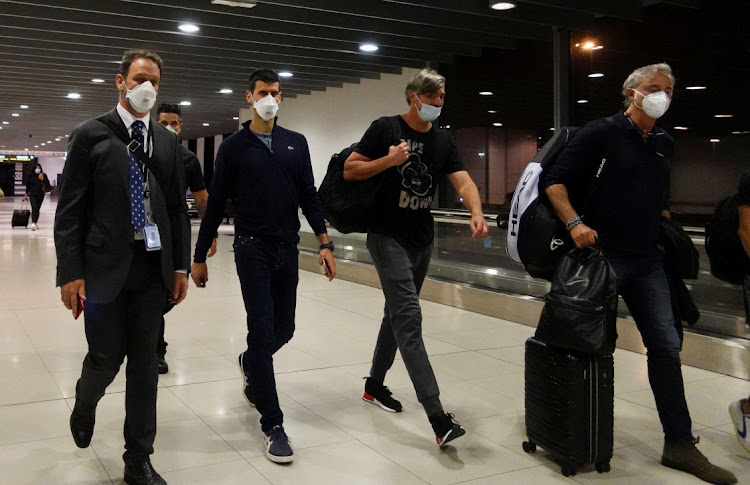 Serbian tennis player Novak Djokovic walks in Melbourne Airport before boarding a flight in Melbourne, Australia, January 16 2022. Picture: LOREN ELLIOTT/REUTERS