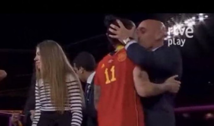 In a screenshot of a video shared on social media, Spanish soccer federation president Luis Rubiales kisses Spain player Jenni Hermoso in the medals and trophy presentation after the team's victory in the 2023 Fifa Women's World Cup final against England at Stadium Australia in Sydney.