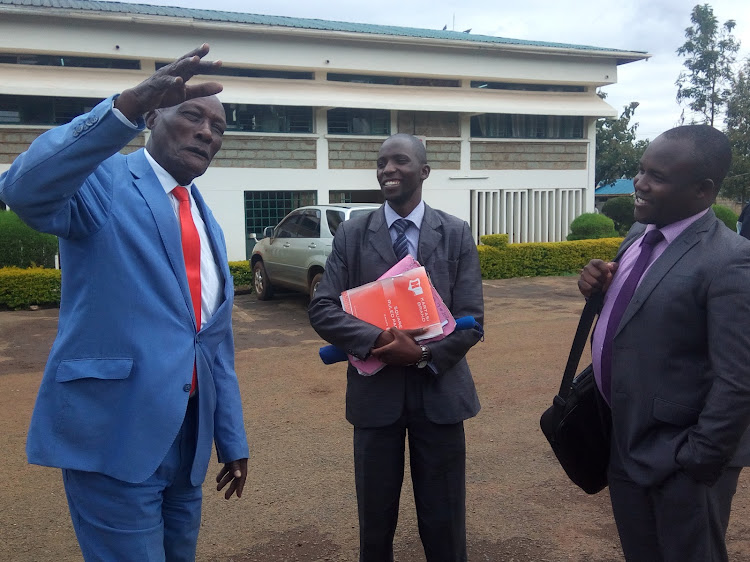 Ex-politician Jackson Kibor with his lawyers outside the courts in Eldoret on October 3, 2019.