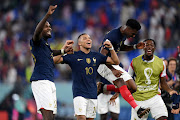 Marcus Thuram and Kylian Mbappe of France celebrate after the 2-1 win during the FIFA World Cup Qatar 2022 Group D match against Denmark at Stadium 974 on November 26, 2022 in Doha, Qatar.