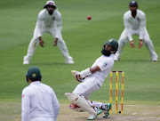 Hashim Amla avoids a bouncer. 