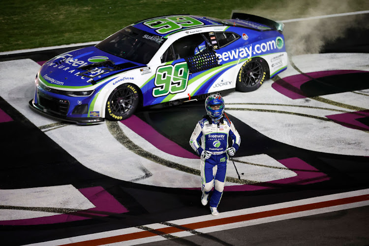 Daniel Suarez celebrates after winning the NASCAR Cup Series Ambetter Health 400 at Atlanta Motor Speedway on February 25 2024 in Hampton, Georgia.