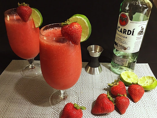 Two tall glasses filled with delicious homemade Strawberry Daiquiri