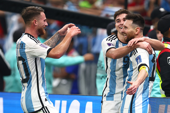 Argentina attacker Julian Alvarez celebrates scoring the third goal with captain Lionel Messi and Alexis MacAllister during the Fifa World Cup Qatar 2022 semifinal against Croatia at Lusail Stadium on December 13 2022 in Lusail City.