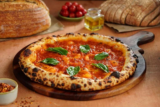 Sourdough Marinara With Basil Leaves Pizza.