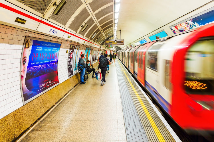 Passengers on a London Underground platform.