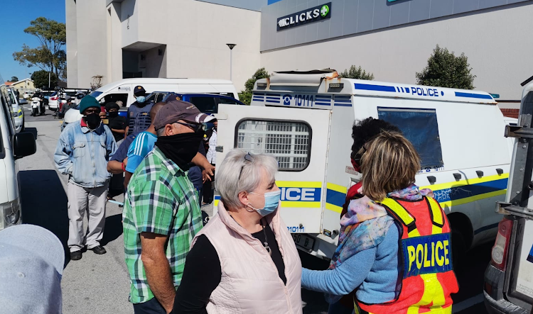 Diane Attwell is led out of the Walmer Park Shopping centre shortly after the altercation with EFF supporters. File photo.