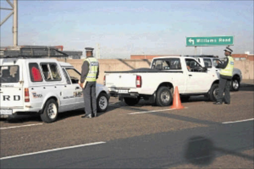 CRACKDOWN: Traffic police stop cars during a roadblock on Durban's Williams Road. Photo: Thuli Dlamini