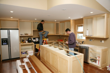 trade partners working on kitchen remodel in michigan custom built