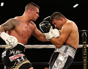 Kevin Lerina connects with combinations punches on Sefer Seferi of Switzerland during their IBO cruiserweight title fight at Emperors Palace.