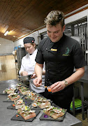   Chef Alex Poltera at work with pastry chef Cayley Slater.