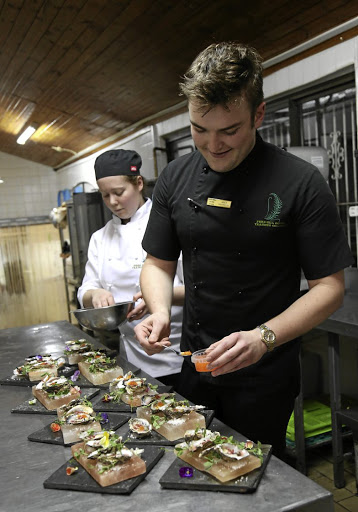 Chef Alex Poltera at work with pastry chef Cayley Slater.