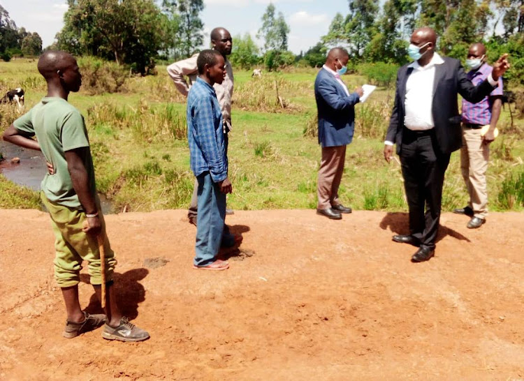 Uasin Gishu roads executive Gideon Birir meets residents during inspection of rural roads on July 28, 2021