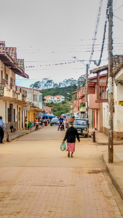 an old lady walking on the street in Samaipata, Bolivia