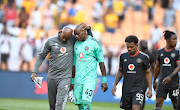 Orlando Pirates' goalkeeper coach Tyrone Damons consoles keeper Siyabonga Mpontshane after the DStv Premiership Soweto derby against Kaizer Chiefs at FNB Stadium on October 29.