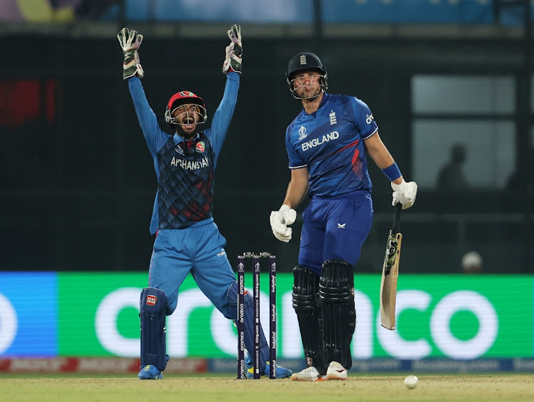 Afghanistan's Rahmanullah Gurbaz appeals successfully for the wicket of England's Liam Livingstone, lbw bowled by Rashid Khan at Arun Jaitley Stadium, New Delhi, India. October 15 2023. Picture: ANUSHREE FADNAVIS/REUTERS