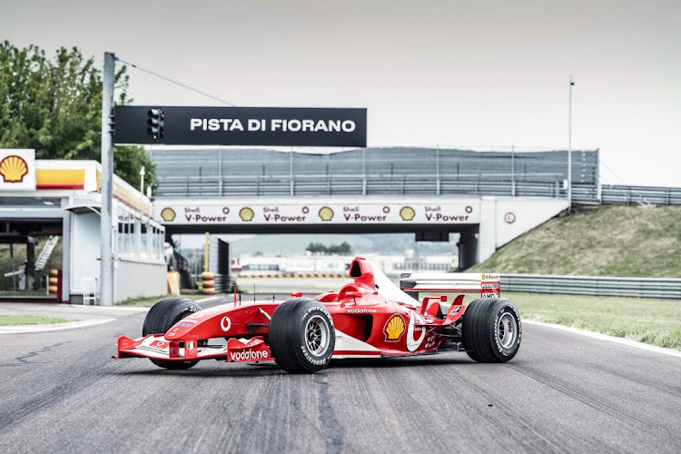 The red "Chassis 229" Ferrari raced by German world-champion driver Schumacher fetched $14.8m. Picture: SOTHEBYS.COM