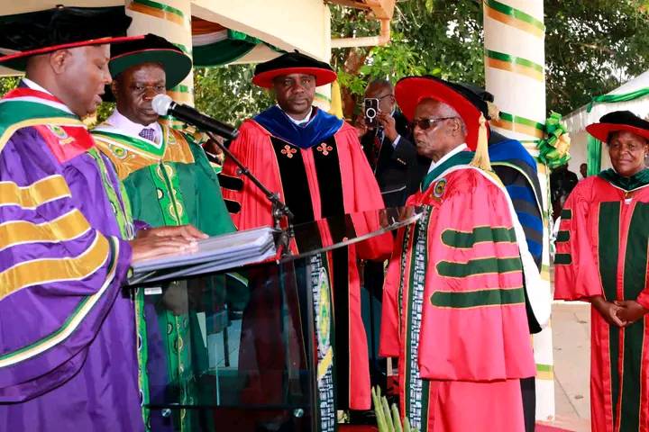 Meru University Chancellor James Mwangi (left), institution's VC Romanus Odhiambo and two of the institution's council members during the graduation ceremony.