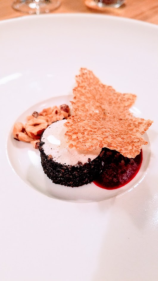 Farm Spirit 7:45 PM seating on December 16th dinner: Dessert 1`of 2, this is the Cultured hazelnut that is vegan but goes through the same process like cheesemaking, here with leek ash, and served with smoked beet juice, hazelnut crumble, and flax cracker