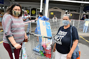 Happy buyers - Tamara Fegen with her mother, Mrs JL Young bought a TV, pvr and stand for R5184 and saved R1000. The other smaller goods totalled R1000 but was reduced to R800.