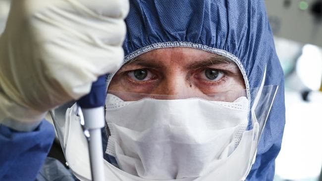 Scientist in lab using a pipette