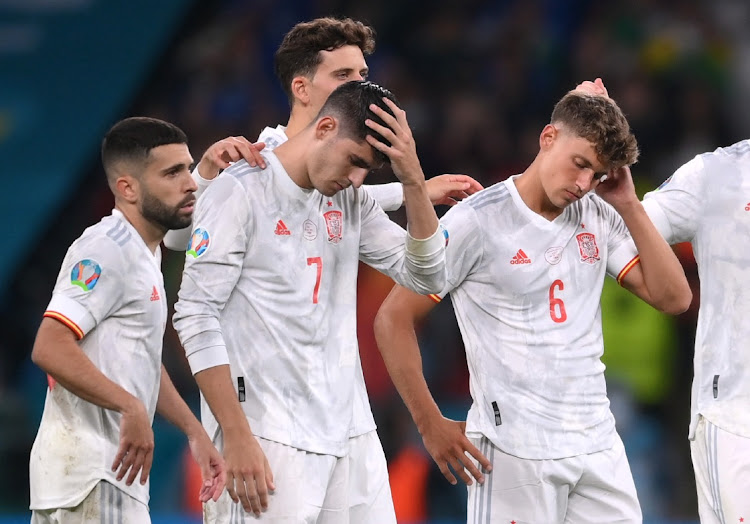 Spain's Jordi Alba, Alvaro Morata and Marcos Llorente look dejected after the penalty shoot-out