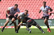 PJ Botha of the Lions with the ball during the United Rugby Championship match against Munster at Ellis Park on March 19 2022.