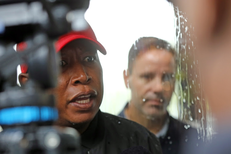 January 19 2022. Romon De Comarmond Manager of kream Restaurant refused to talk to EFF leader Julius Malema is seen looking at Malema through a glass door. Malemavisited the restaurant to check if the retio between South Africans and foreign nationals is balanced.