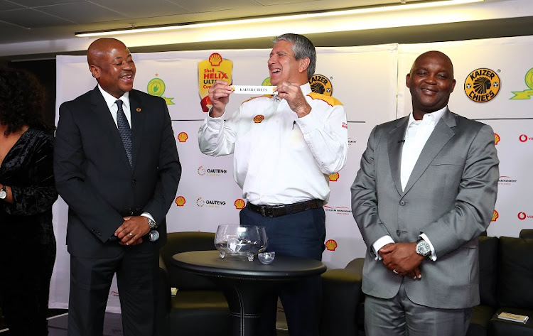 Bobby Motaung, Football Manager of Kaizer Chiefs, Anton Niemann, Shell Downstream SA General Manager (c) and Pitso Mosimane, Coach of Mamelodi Sundowns conduct the draw during the launch of the 2018 Shell Helix Ultra Cup presented by SMSA at FNB Stadium, Johannesburg on 28 May 2018.