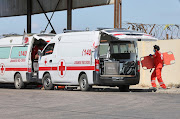 A member of the Lebanese Red Cross holds a stretcher as he waits with his colleagues to receive dead bodies after sinking of a migrant boat which according to Lebanese and Syrian officials sank off at Syrian coast after sailing from Lebanon, at the Lebanese-Syrian border crossing in Arida, Lebanon September 23, 2022. 