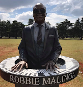 The Malinga family was happy with this second version of the Robbie Malinga statue-tombstone.