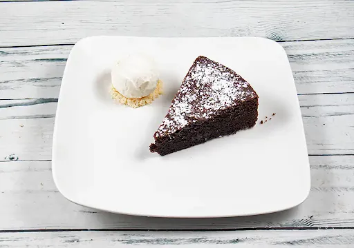 Capri Chocolate Cake Slice With Almond Flour And Vanilla Ice Cream