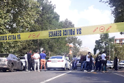 Police cordoned off the scene in Pretoria after e-hailers allegedly attacked a police officer travelling in an unmarked car, assaulted him and disarmed him before firing a shot. 