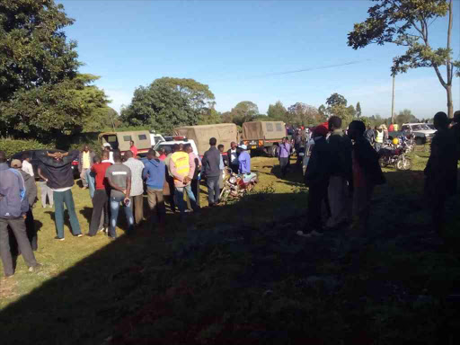 Residents at the scene where a woman was murdered in Litein, Kericho, Wednesday, February 20, 2019. /FELIX KIPKEMOI